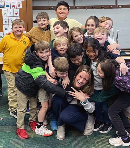 Ashlee with students